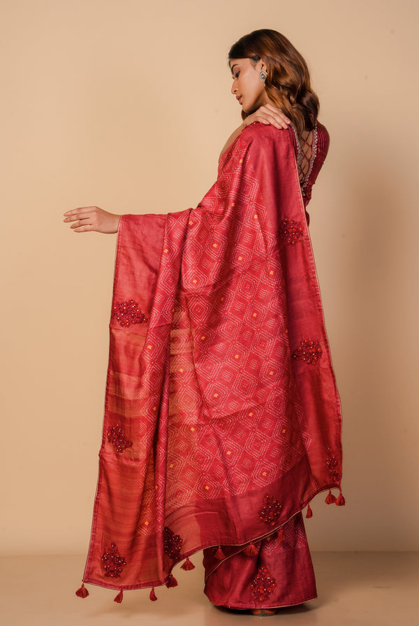 A woman wearing dark red pure tussar printed saree, latest saree, new saree collection