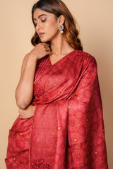 A woman wearing dark red pure tussar printed saree, latest saree, new saree collection