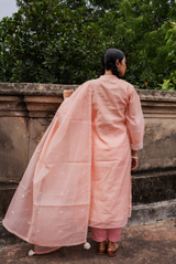 A women wearing pinkish chanderi suit set, ethnic wear for women