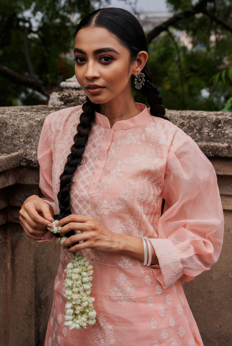 A women wearing pinkish chanderi suit set, ethnic wear for women