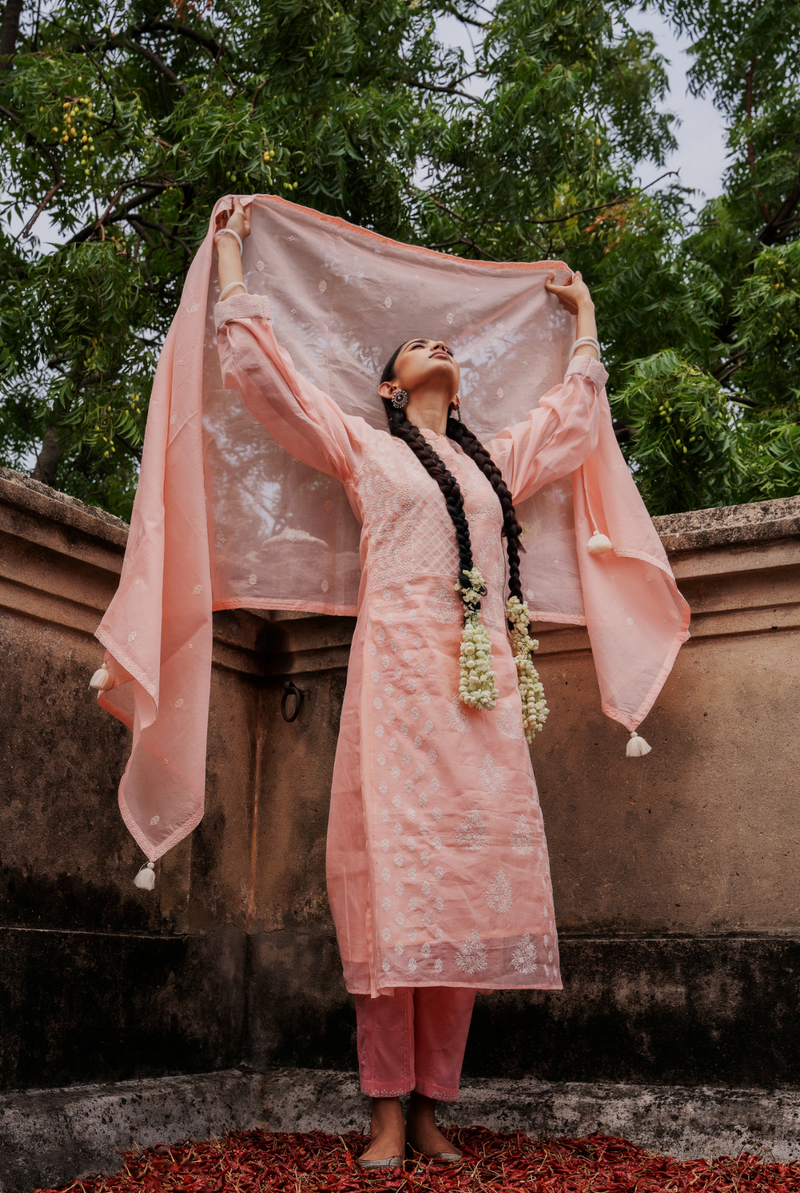 A women wearing pinkish chanderi suit set, ethnic wear for women
