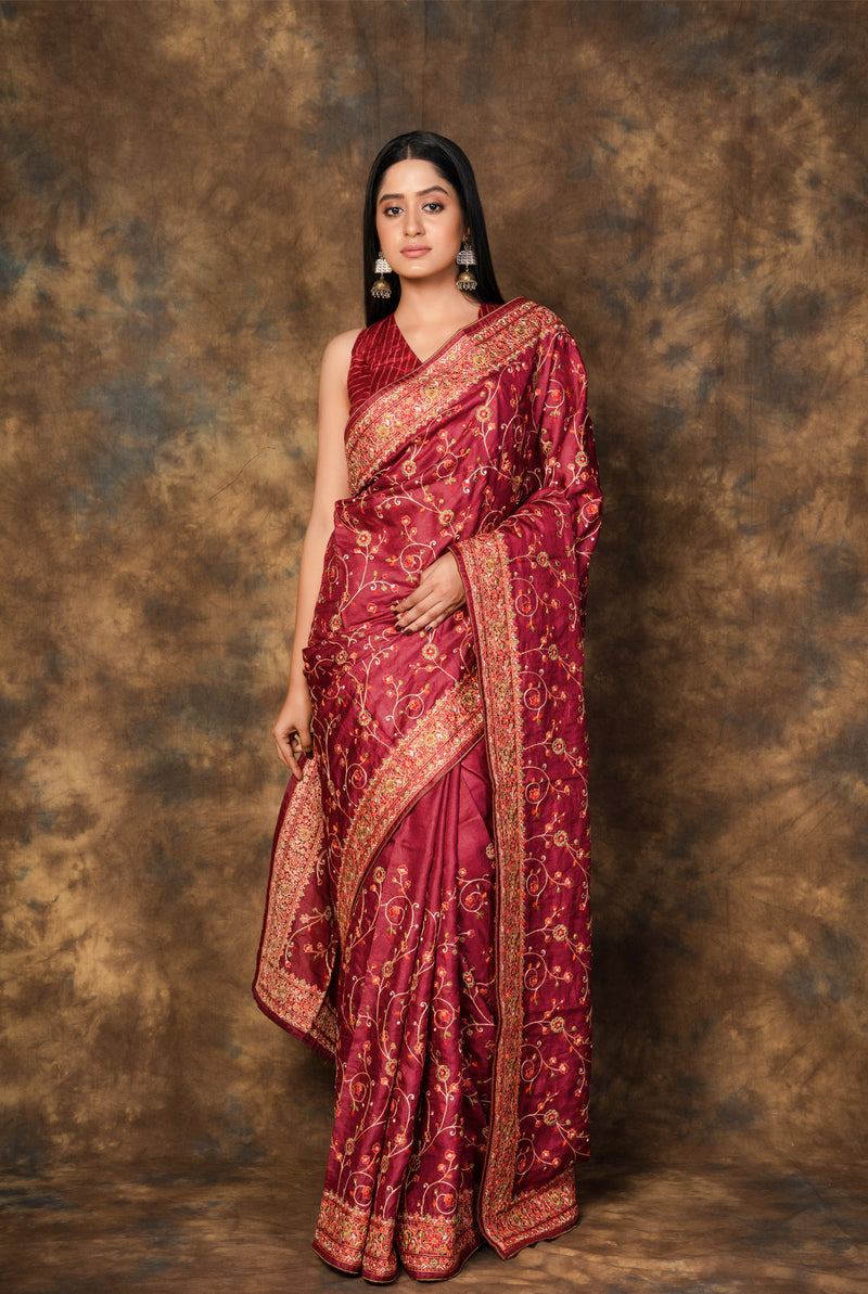 A woman wearing maroon pure tussar saree, latest saree, new saree collection