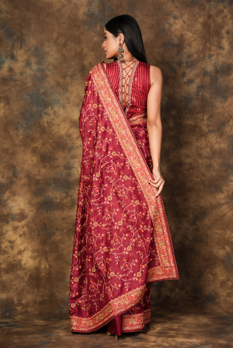 A woman wearing maroon pure tussar saree, latest saree, new saree collection