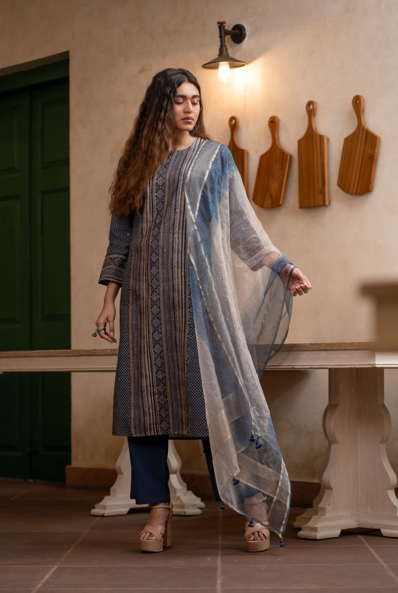 A women wearing greyish pure chanderi suit set, ethnic wear for women 