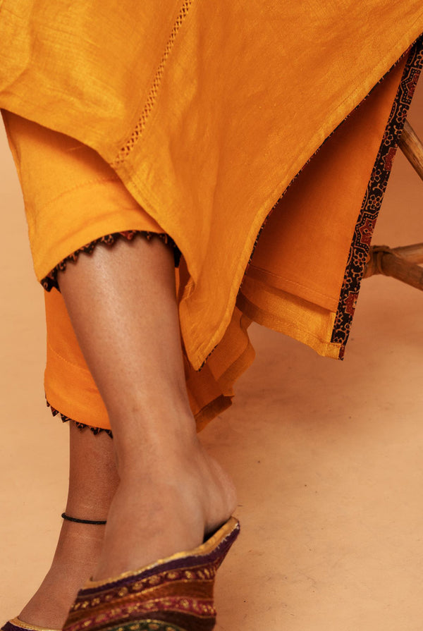 A women wearing mustard pure tussar kurti set, ethnic wear for women