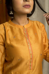 A women wearing mustard chanderi salwar suit, Indian wear for women