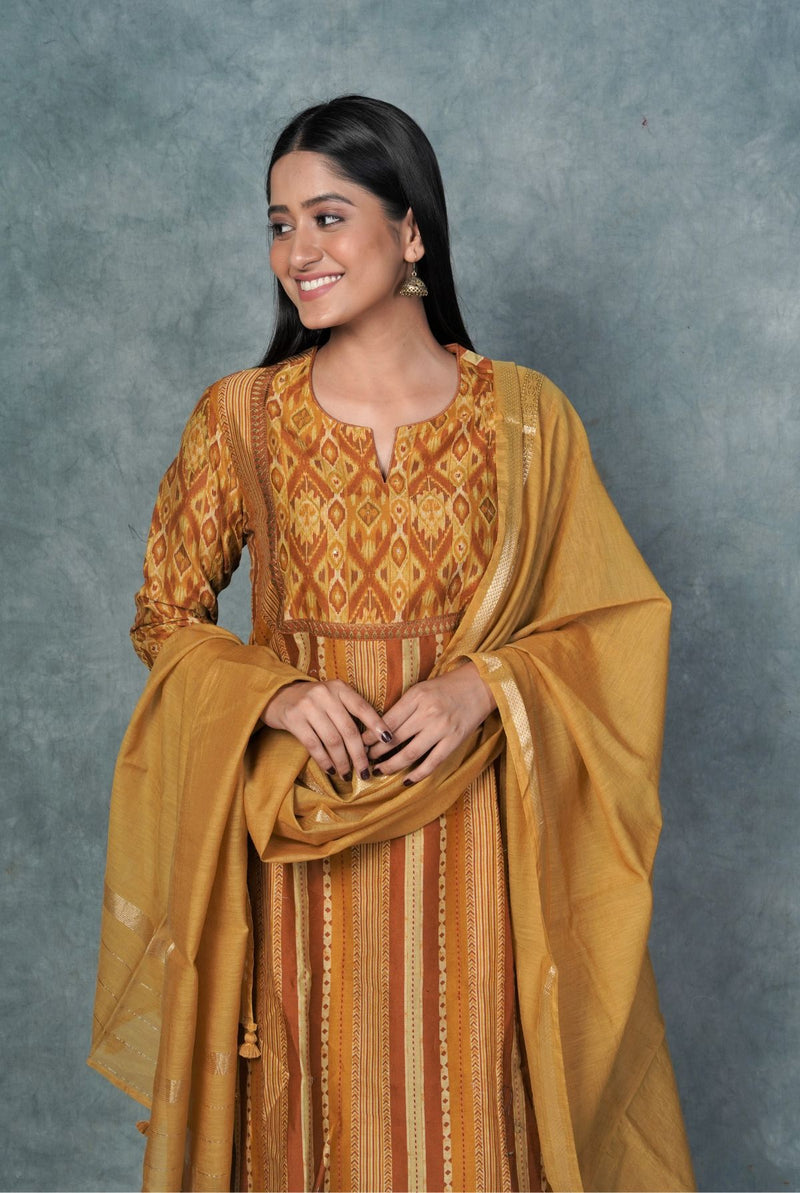 A women wearing mustard pure chanderi salwar suit, ethnic wear for women