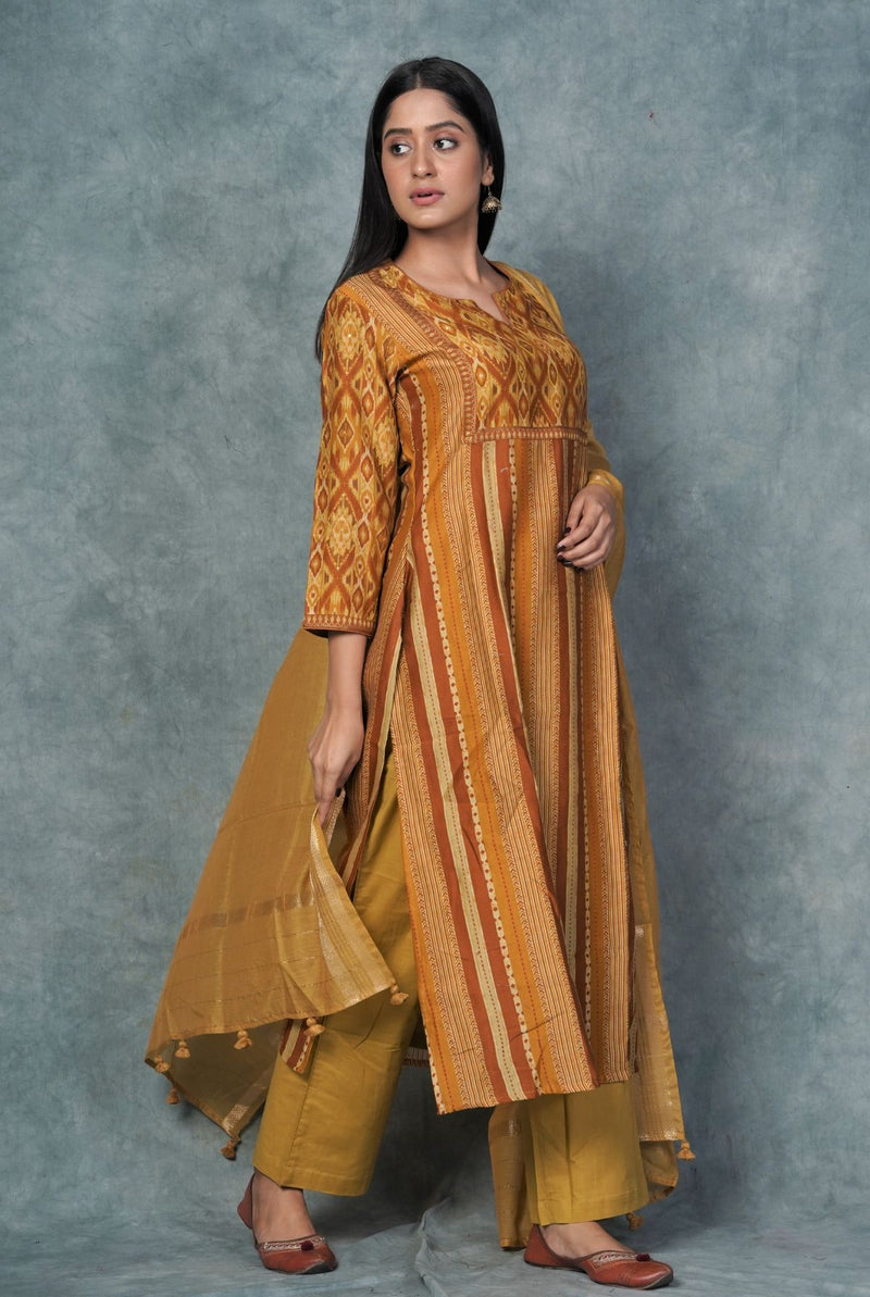 A women wearing mustard pure chanderi salwar suit, ethnic wear for women