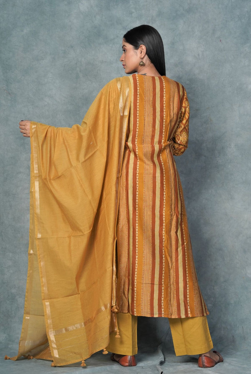 A women wearing mustard pure chanderi salwar suit, ethnic wear for women