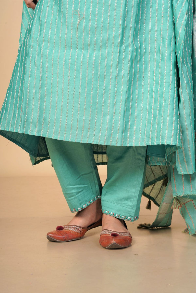 A women wearing green pure chanderi salwar suit, ethnic wear for women