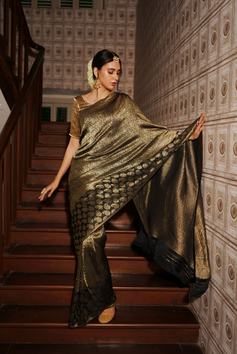 A woman wearing black pure crepe saree, latest saree, new saree collection