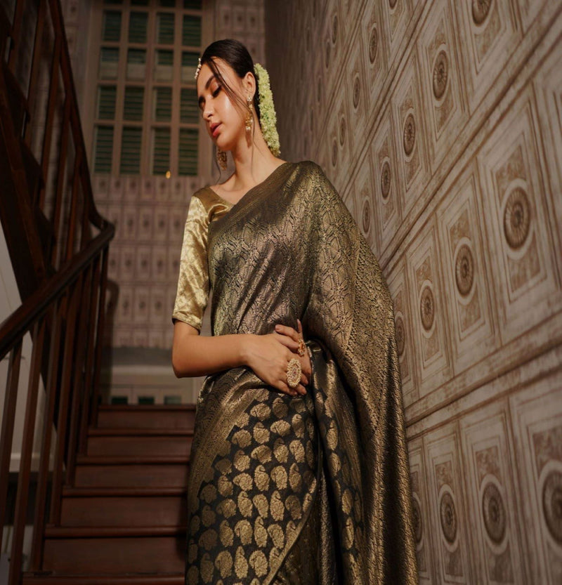 A woman wearing black pure crepe saree, latest saree, new saree collection