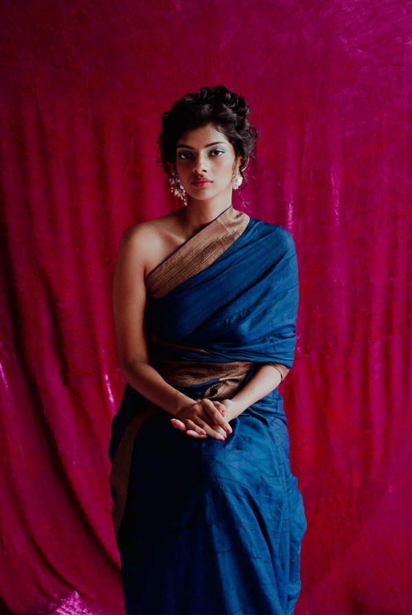 A woman wearing dark blue pure tussar saree, latest saree, new saree collection