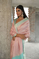 A woman wearing pure crepe pastel pink saree, latest saree, new saree collection