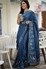 A woman wearing blue pure tussar saree, latest saree, new saree collection