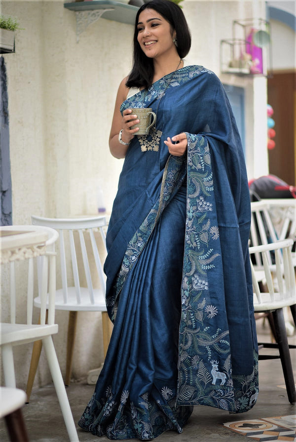 A woman wearing blue pure tussar saree, latest saree, new saree collection
