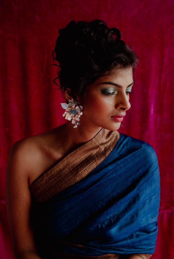 A woman wearing dark blue pure tussar saree, latest saree, new saree collection