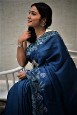 A woman wearing blue pure tussar saree, latest saree, new saree collection