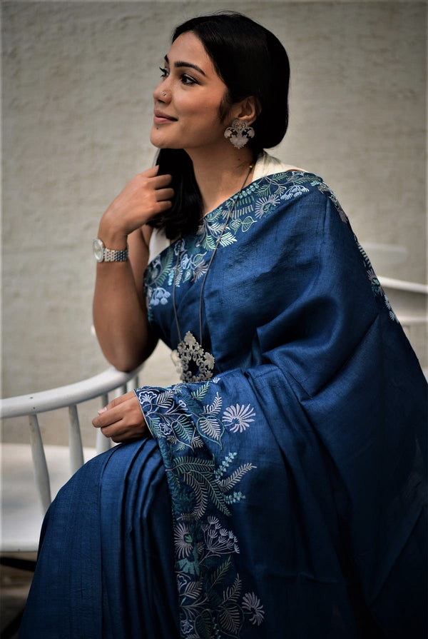 A woman wearing blue pure tussar saree, latest saree, new saree collection