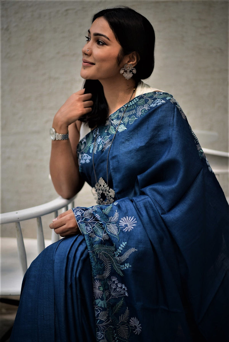 A woman wearing blue pure tussar saree, latest saree, new saree collection