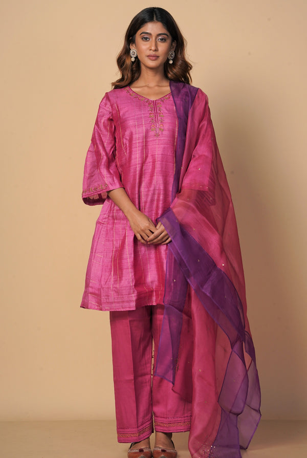 A women wearing fuschia pure tussar party wear salwar suit, ethnic wear for women