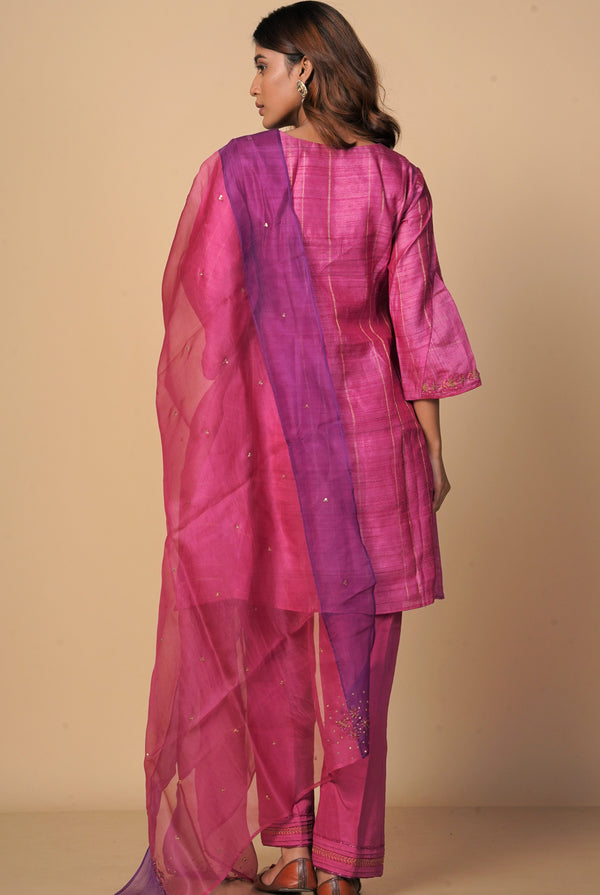 A women wearing fuschia pure tussar party wear salwar suit, ethnic wear for women