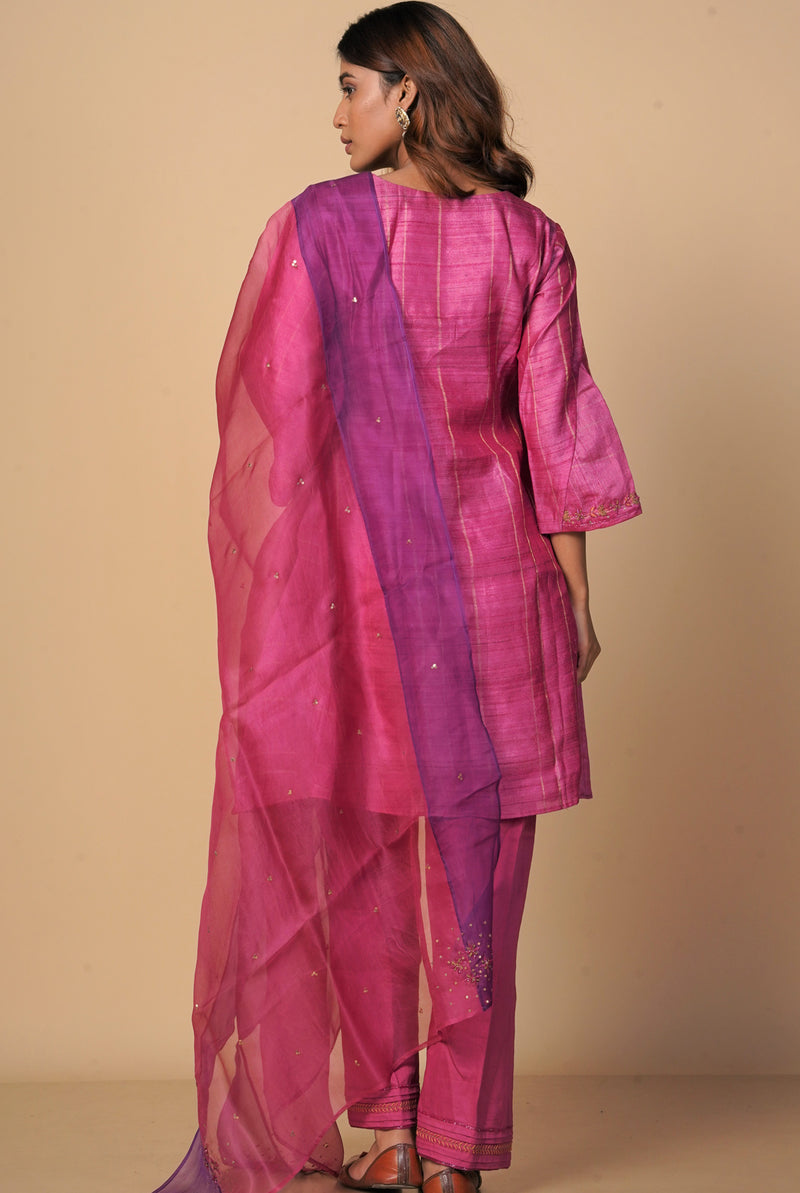 A women wearing fuschia pure tussar party wear salwar suit, ethnic wear for women
