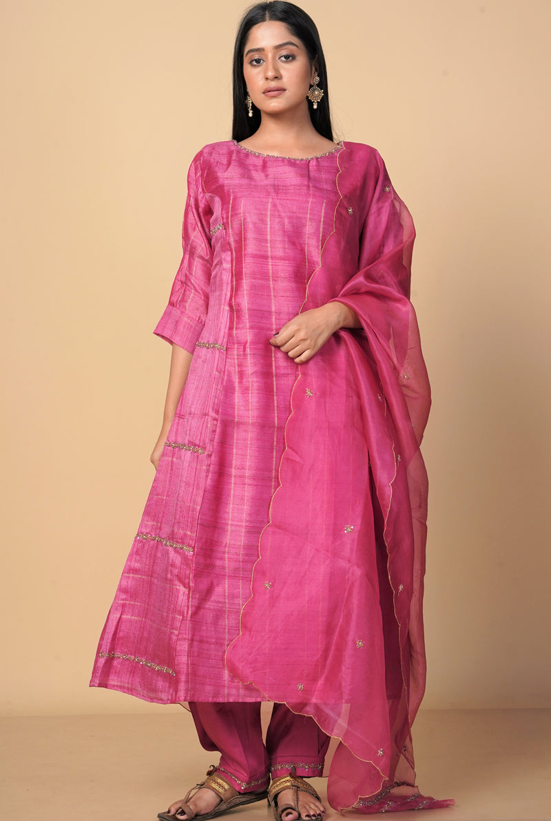 A women wearing fuschia pure tussar party wear salwar suit, ethnic wear for women