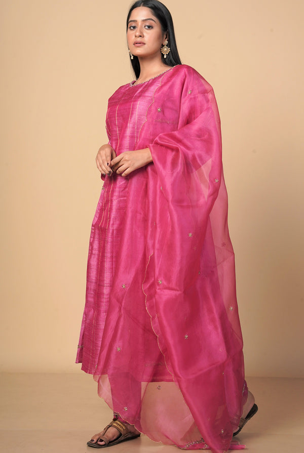 A women wearing fuschia pure tussar party wear salwar suit, ethnic wear for women