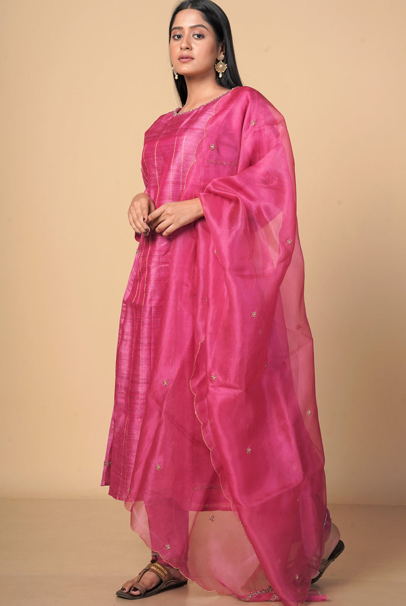 A women wearing fuschia pure tussar party wear salwar suit, ethnic wear for women