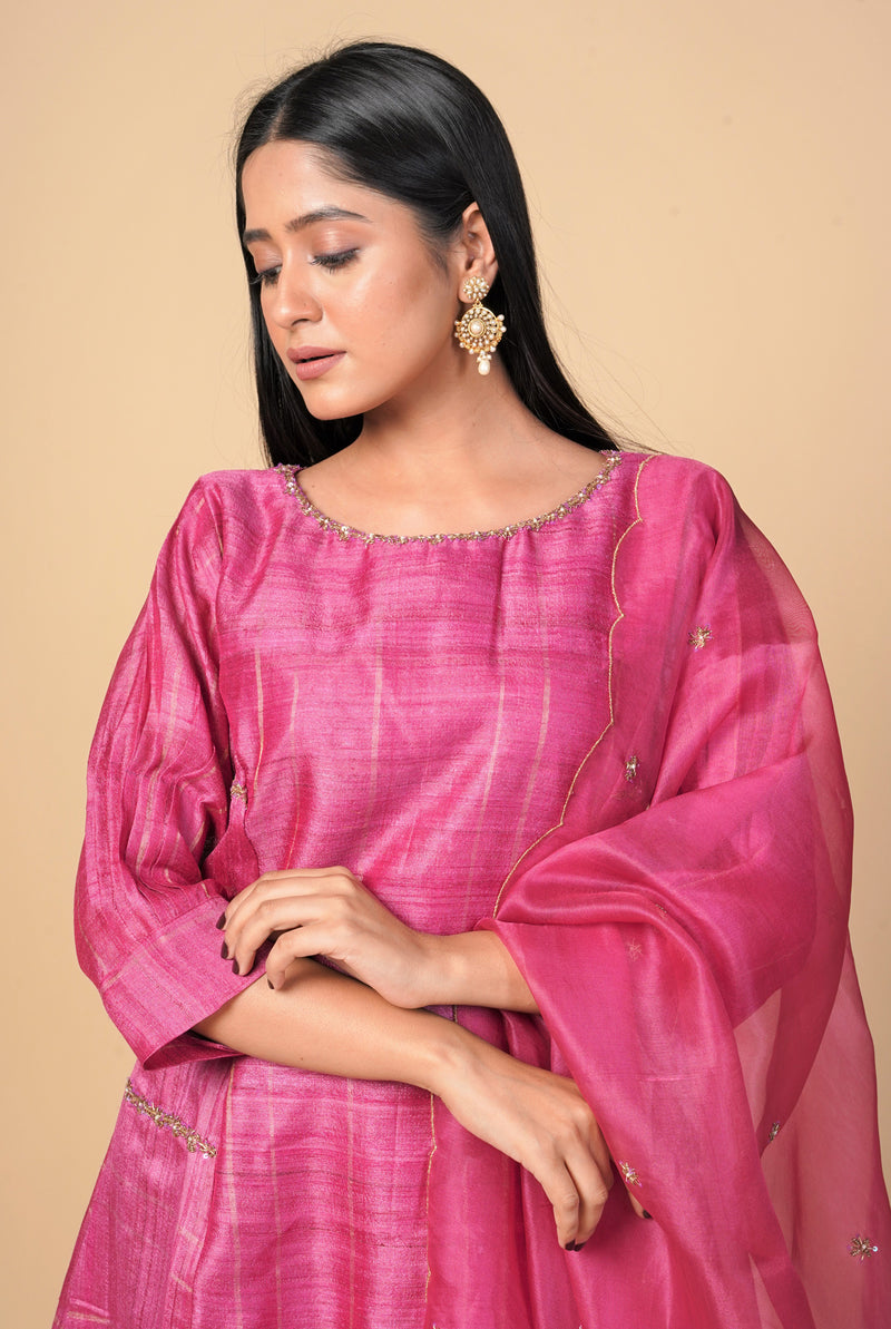 A women wearing fuschia pure tussar party wear salwar suit, ethnic wear for women