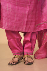 A women wearing fuschia pure tussar party wear salwar suit, ethnic wear for women