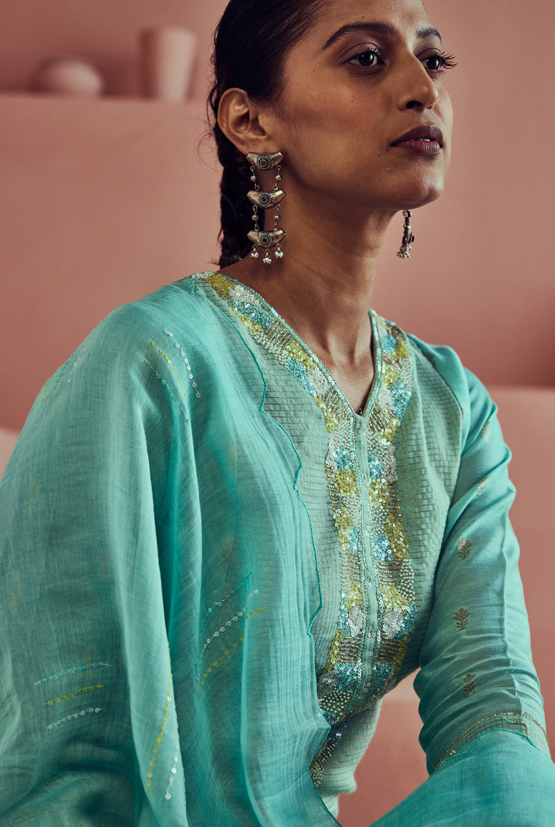 A women wearing pure fancy chanderi firoza suit set with malai chanderi dupatta, ethnic wear for women.