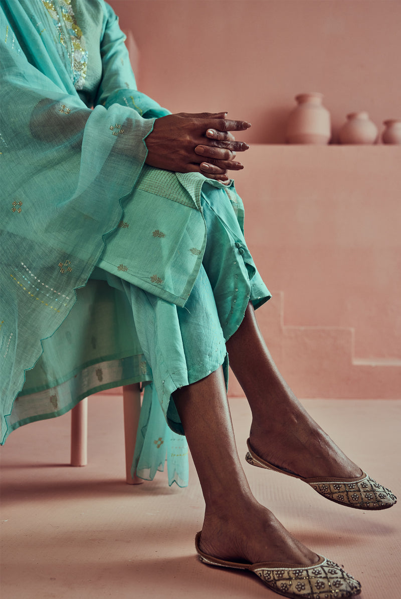 A women wearing pure fancy chanderi firoza suit set with malai chanderi dupatta, ethnic wear for women.