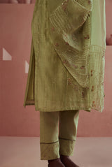 A women wearing pastel green fancy chanderi suit set with organza dupatta, ethnic wear for women.
