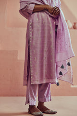 A women wearing pure fancy chanderi lilac suit set, ethnic wear for women.