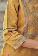 A women wearing mustard party wear salwar suit, ethnic wear for women.