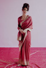 A woman wearing rani pure tissue saree, latest saree, new saree collection
