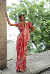 A woman wearing pure georgette hand dyed saree, latest saree, new saree collection