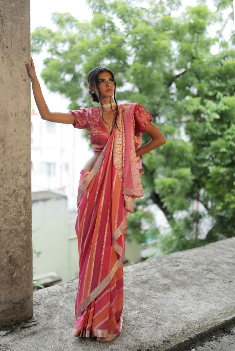 A woman wearing pure georgette hand dyed saree, latest saree, new saree collection