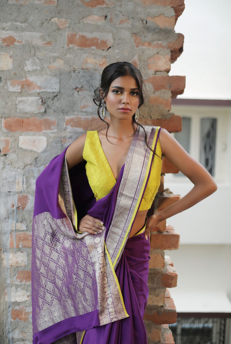 A woman wearing purple pure crepe saree, latest saree, new saree collection