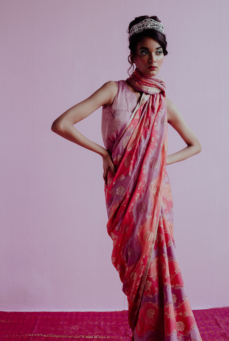 A woman wearing pure crepe saree, latest saree, new saree collection