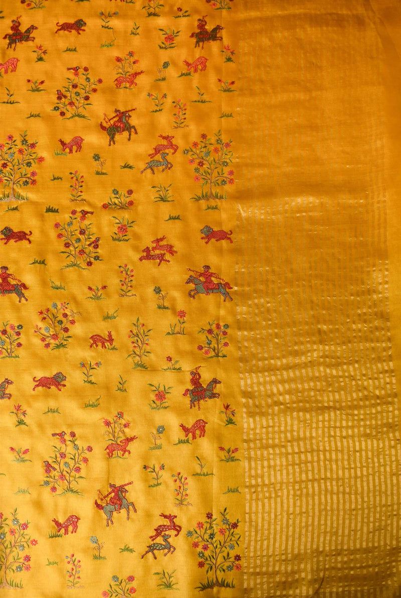 A woman wearing mustard tussar resham embroidered saree, latest saree, new saree collection