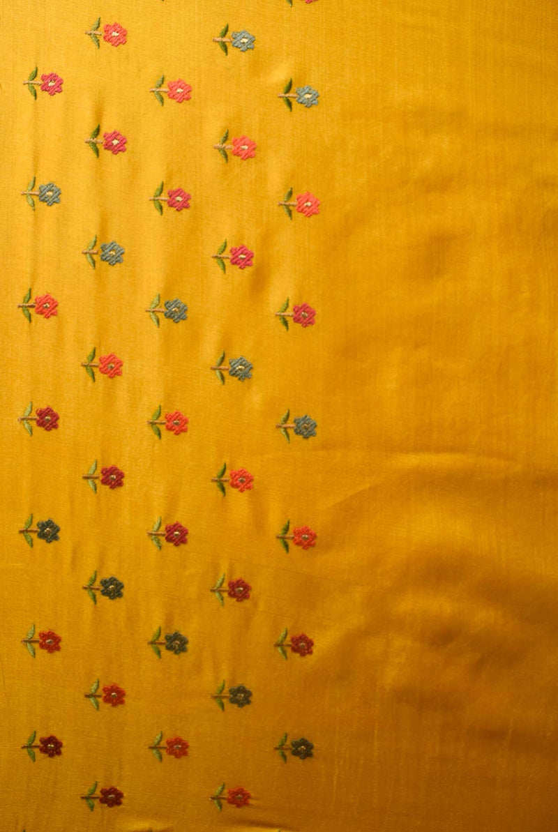 A woman wearing mustard tussar resham embroidered saree, latest saree, new saree collection