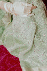 A woman wearing light blue pure crepe saree, latest saree, new saree collection