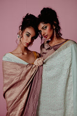 A woman wearing lilac pure crepe saree, latest saree, new saree collection
