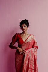 A woman wearing bright red pure crepe saree, latest saree, new saree collection