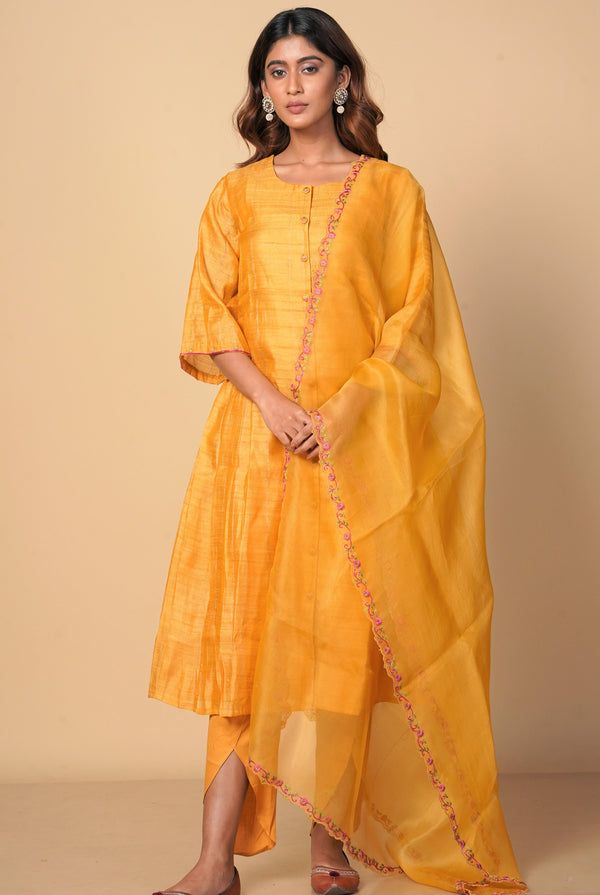 A women wearing mustard pure tussar party wear salwar suit, ethnic wear for women