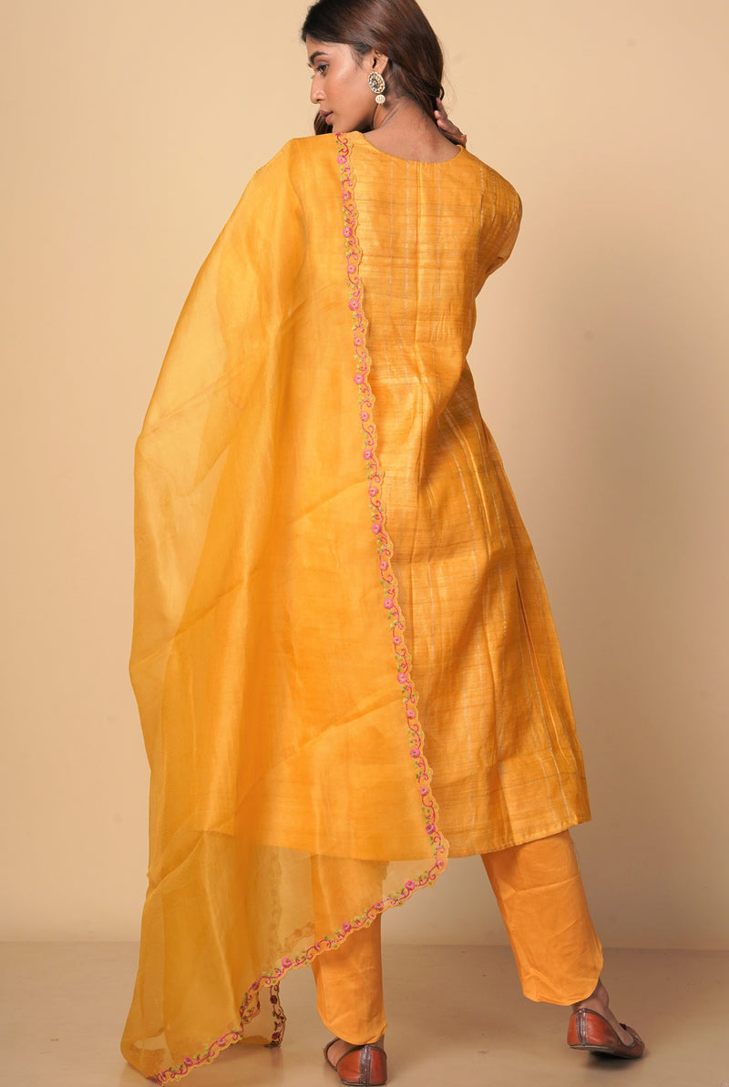 A women wearing mustard pure tussar party wear salwar suit, ethnic wear for women