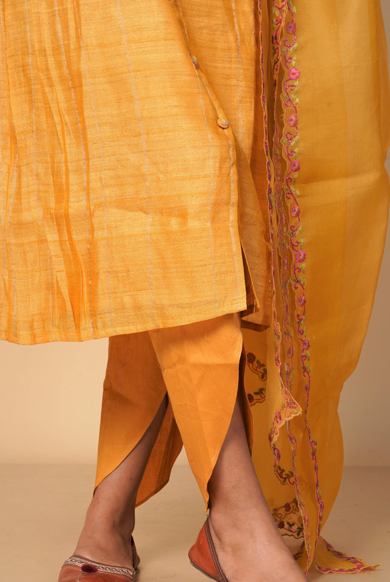 A women wearing mustard pure tussar party wear salwar suit, ethnic wear for women